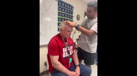 So I am cutting a teachers hair at Fredericksburg High School