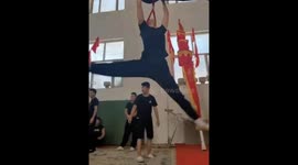 Watch this young acrobat's incredible neck loop performance that will leave you breathless!