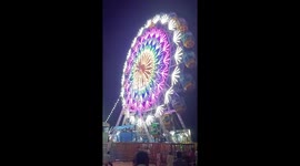 Lightning beautiful ferris wheel in village annual festival of ram navmi, it is rotating Ferris wheel