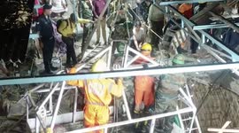 Young girl and woman pulled from debris of temple collapse in India
