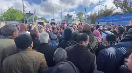 Palestinian Muslim worshippers heading to Jerusalem's Al-Aqsa Mosque compound to attend the second Friday noon prayer of the holy month of Ramadan, wait to cross an Israeli held checkpoint in Bethlehem, in the West Bank