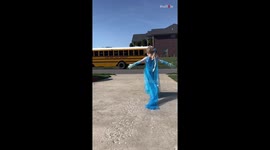 Adorable girl takes a break from her playtime to welcome big sisters back from school