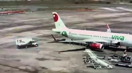 Catering truck crashes into plane at airport in Mexico