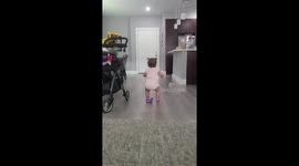 Baby girl loses balance and takes a silly fall while dancing like no one's watching