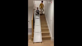 *DIY slide idea* Kids enjoying their makeshift stair slide with delight