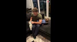 Dad shows that putting a baby in pajamas isn't as easy as it may seem