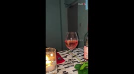 Woman glows with joy after fiancé surprises her with a candlelight dinner during her on-call shift
