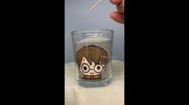 Sand artist creates a spell-binding Harry Potter portrait in a glass
