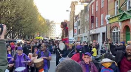 Crowds follow Little Amal puppet as she passes through Camden