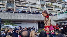 Refugee puppet Little Amal continues her journey in London accompanied by uplifting gospel choir