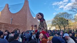 Giant refugee puppet Little Amal's Ramadan lantern parade walk to iftar in London's King's Cross