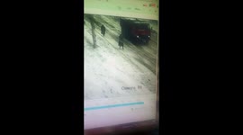 Dramatic moment elderly women are buried in snow while walking on street in Russia