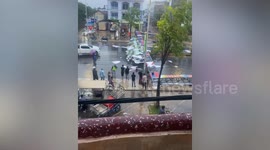 One dead and one injured after billboard collapses during storm in Cambodia