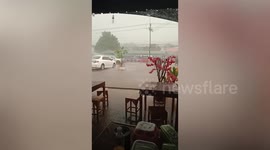 Noodle shop drenched as heavy rain batters central Thailand