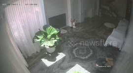 Child playing with candle lighter sets sofa on fire in family's living room