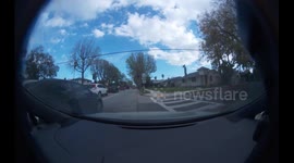 Close Call: Black Car Almost Involved in an Accident Due to Not Looking While Turning