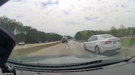 Close Call: White Toyota Pulls Out in Front of Oncoming Vehicle on a Highway