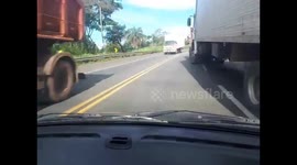 Close Call: Trailer Truck Driver Doesn't Check Mirrors While Changing Lanes