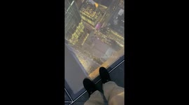 Enjoy a walk on the glass floor on The Edge in a cloudy day in New York