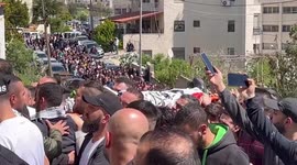 Mourners attend the funeral of Mohammad al-Hallaq and Mohammed Abu Bakr, who were killed during clashes with the Israeli army