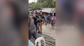 Furious residents clash with security guards over water supply cut  during Philippines heat