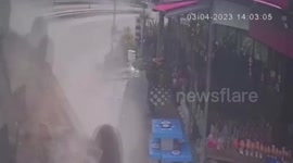 Out-of-control pick-up flips over after ramming front of shop in Thailand