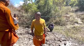 Kind Buddhist monks rescue pregnant cow stuck in thick mud