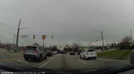 Crash: Blue Car Runs a Red Light at Busy Intersection Resulting in a Crash
