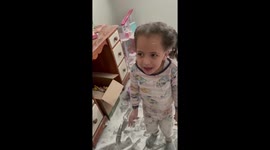 'Am I in trouble?' Three-year-old makes total mess of her room using baby powder