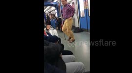 Man pole dances on train in China