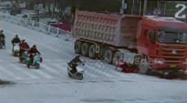 Women escape being run over by the truck
