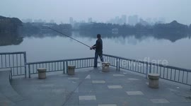 Man goes fishing in a particularly bizarre way