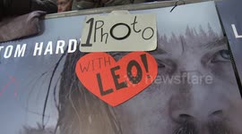 Excited Leonardo DiCaprio fans wait at the premiere of The Revenant