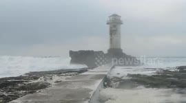 Stormy seas batter lighthouse in France