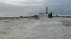 Storm of sea foam on the lighthouse