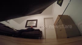 Man jumps out of a box for the 2nd time to scare his flatmate