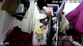 Woman steals shopkeeper's iPhone in clothes shop