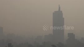 Santiago dawns under a dense cloud of smoke
