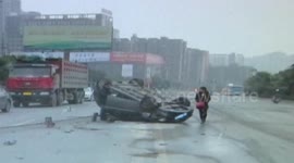 Car flips over after hitting a fence
