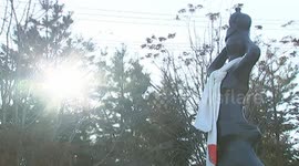 Statues wearing traditional Chinese robes in beautiful, snow-covered park