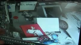Incredible moment a shop clerk is saved by a DESK after out-of-control sedan smashed into a computer store