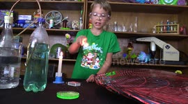 Young boy accidentally burns himself with a match while lighting a bubble of hydrogen gas