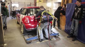 Man lifts Mini Cooper using homemade exoskeleton