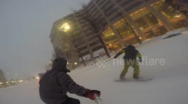 Snowboarding on the streets of Washington DC on the back of a Jeep