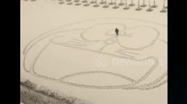 Foot-drawing Doraemon on snow