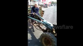 80 years old woman drives tractor in a fast speed
