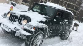 Snowboarding in the Streets of Washington DC during Snowzilla in a Jeep