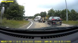 Accident: Heavy Motorbike Topples After Having to Stop at a Roundabout