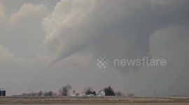 Watch the moment tornado gradually forms as storms sweep through Iowa