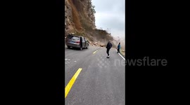 Massive rocks rolling down mountain narrowly miss motorists in China